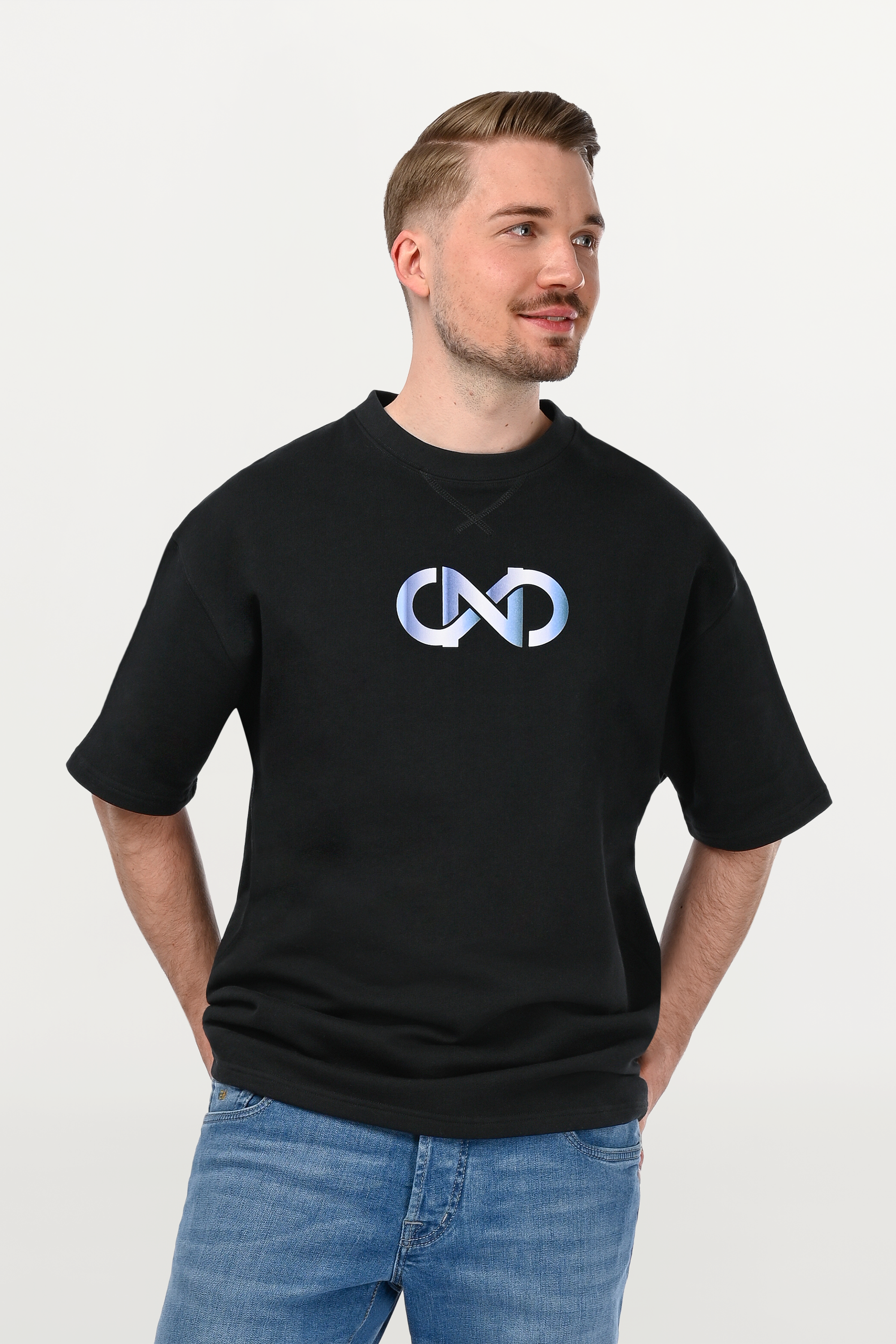 Close-up of sky gradient chest print on black oversized cotton T-shirt, premium ENARMO graphic detail on structured cotton fabric