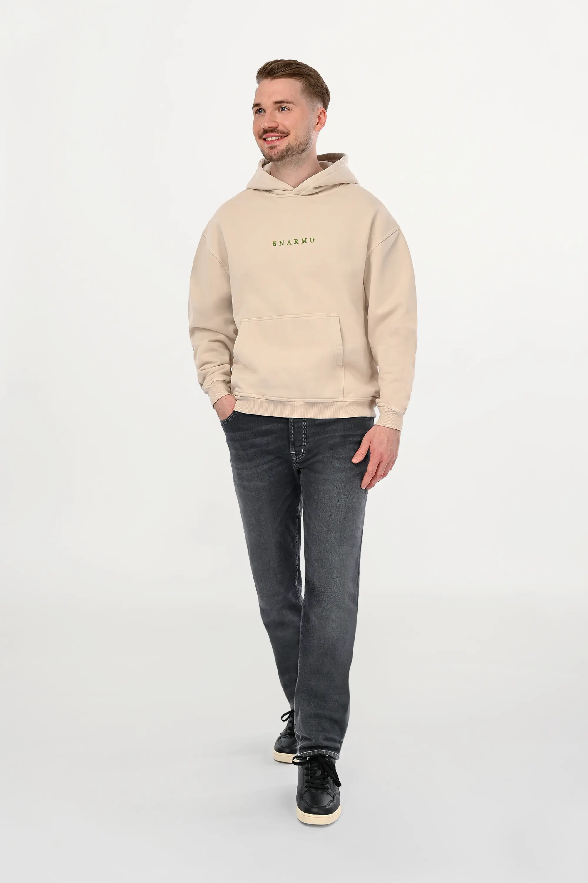 Male model styled in mid grey regular fit jeans featuring refined neutral tone and balanced straight silhouette, contemporary luxury denim look.