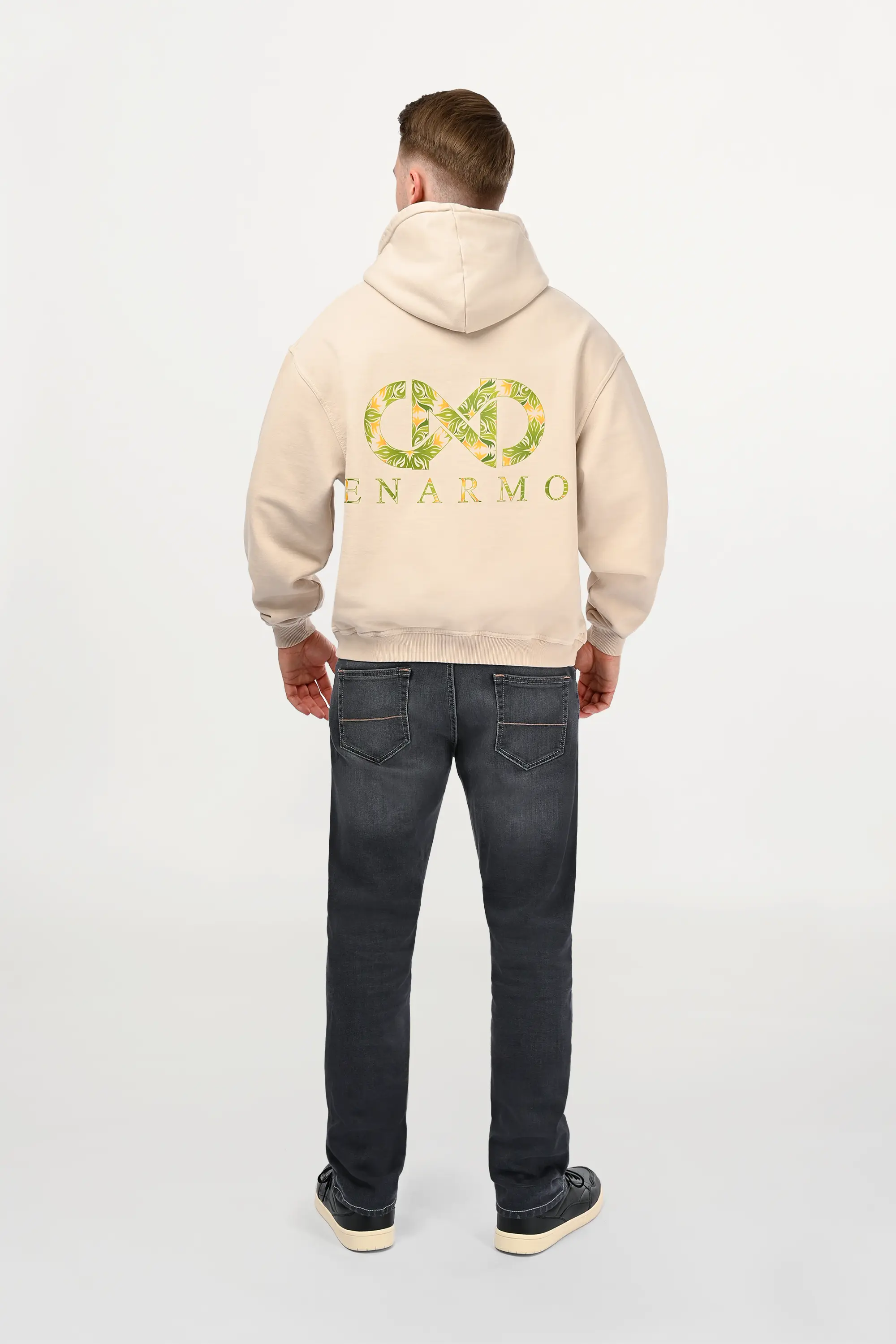 A back perspective of mid grey designer denim jeans worn by the male model, highlighting clean waistband line and modern regular fit profile.