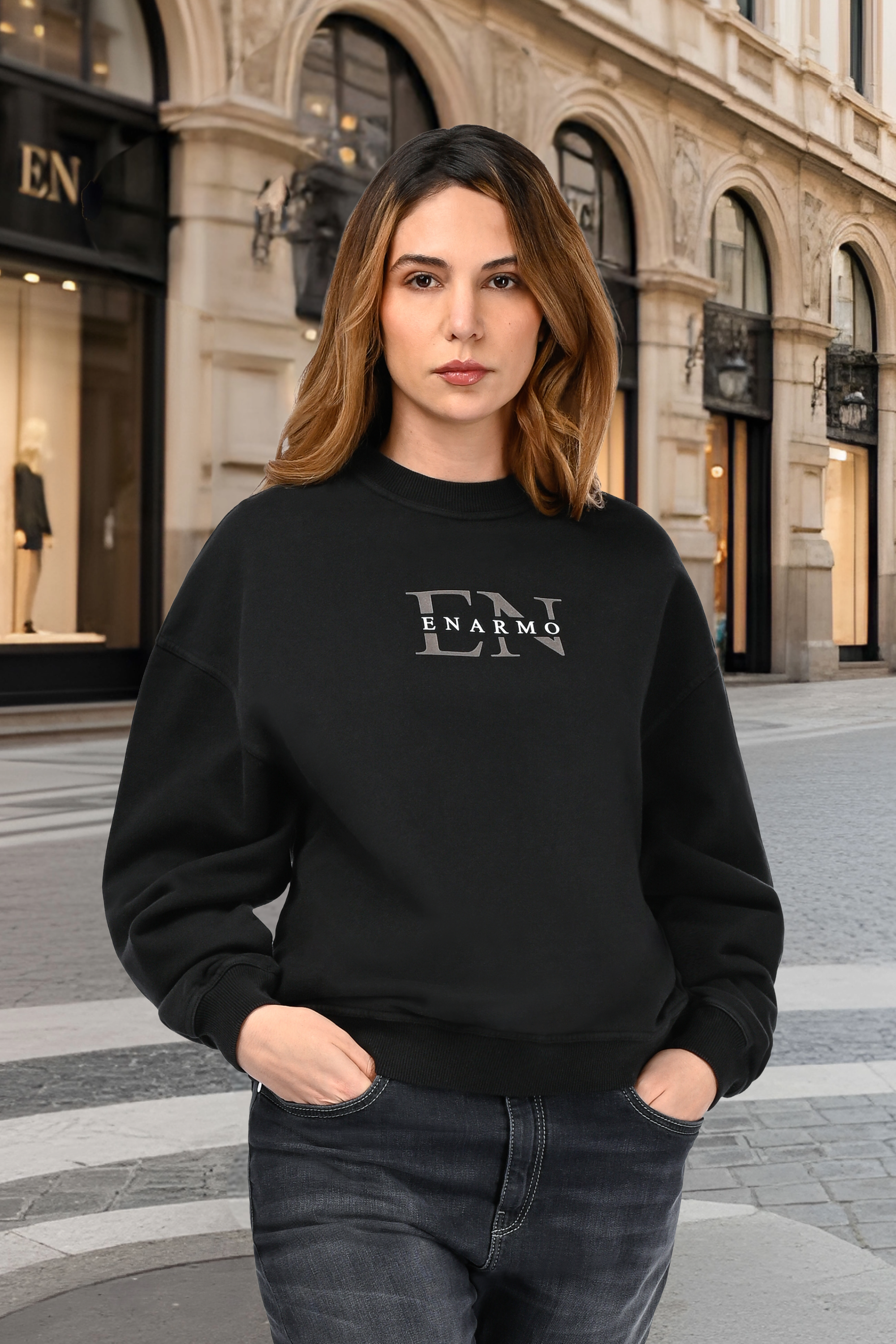 Woman wearing a luxury unisex oversized hoodie with anthracite and white monogram