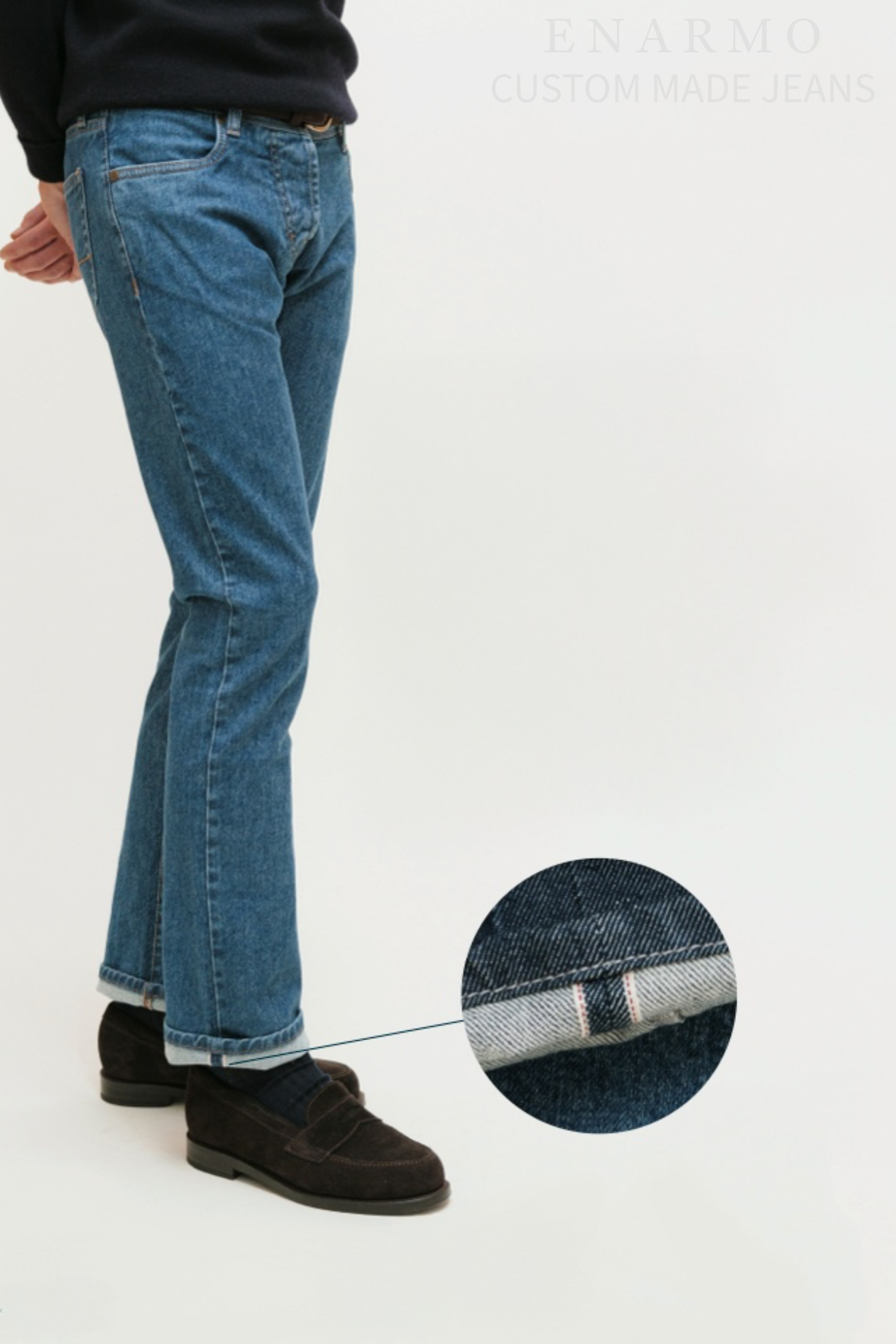 Male model wearing blue selvedge jeans. Additional close up of the selvedge at the bottom