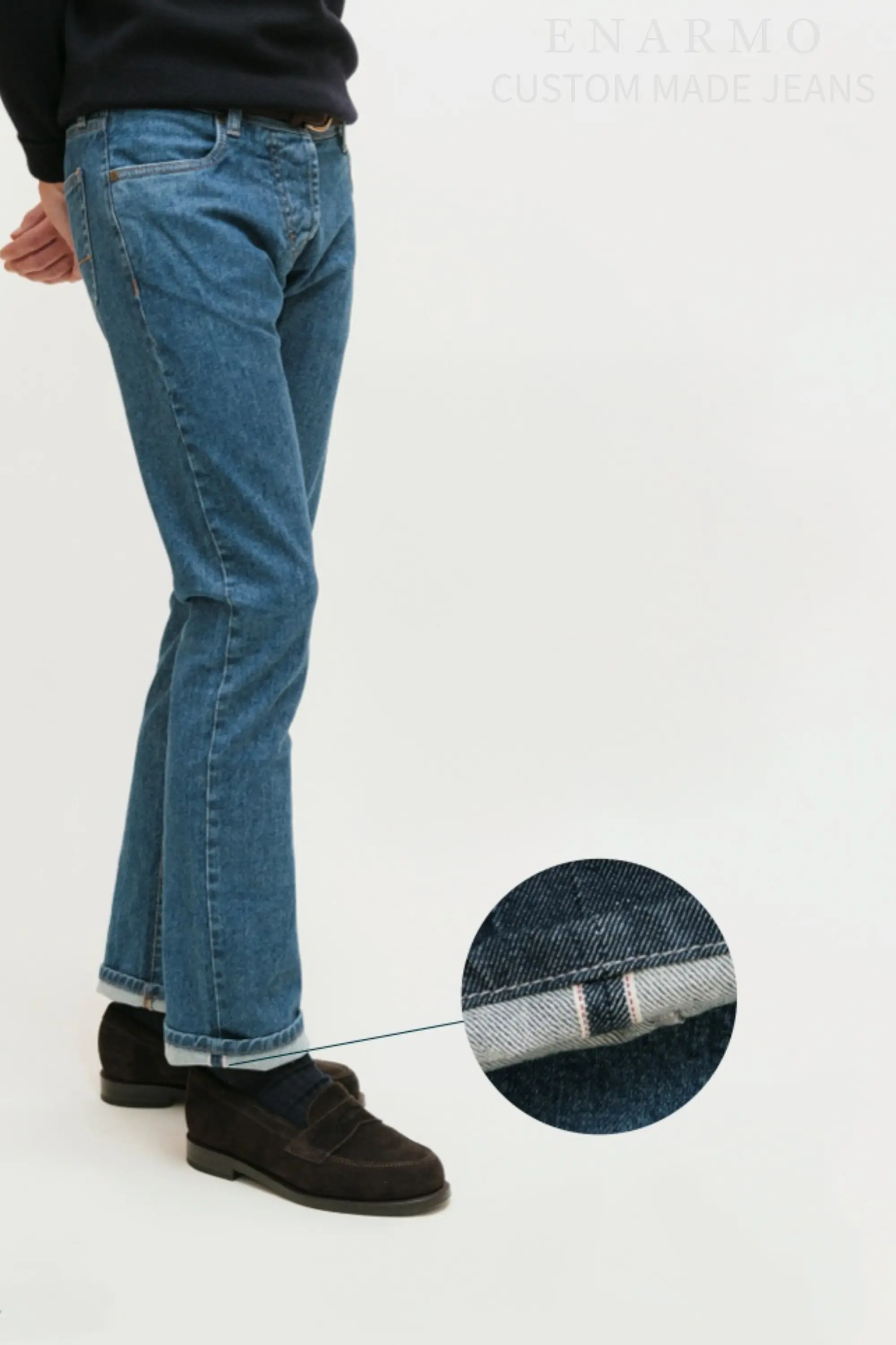 Male model wearing blue selvedge jeans. Additional close up of the selvedge at the bottom