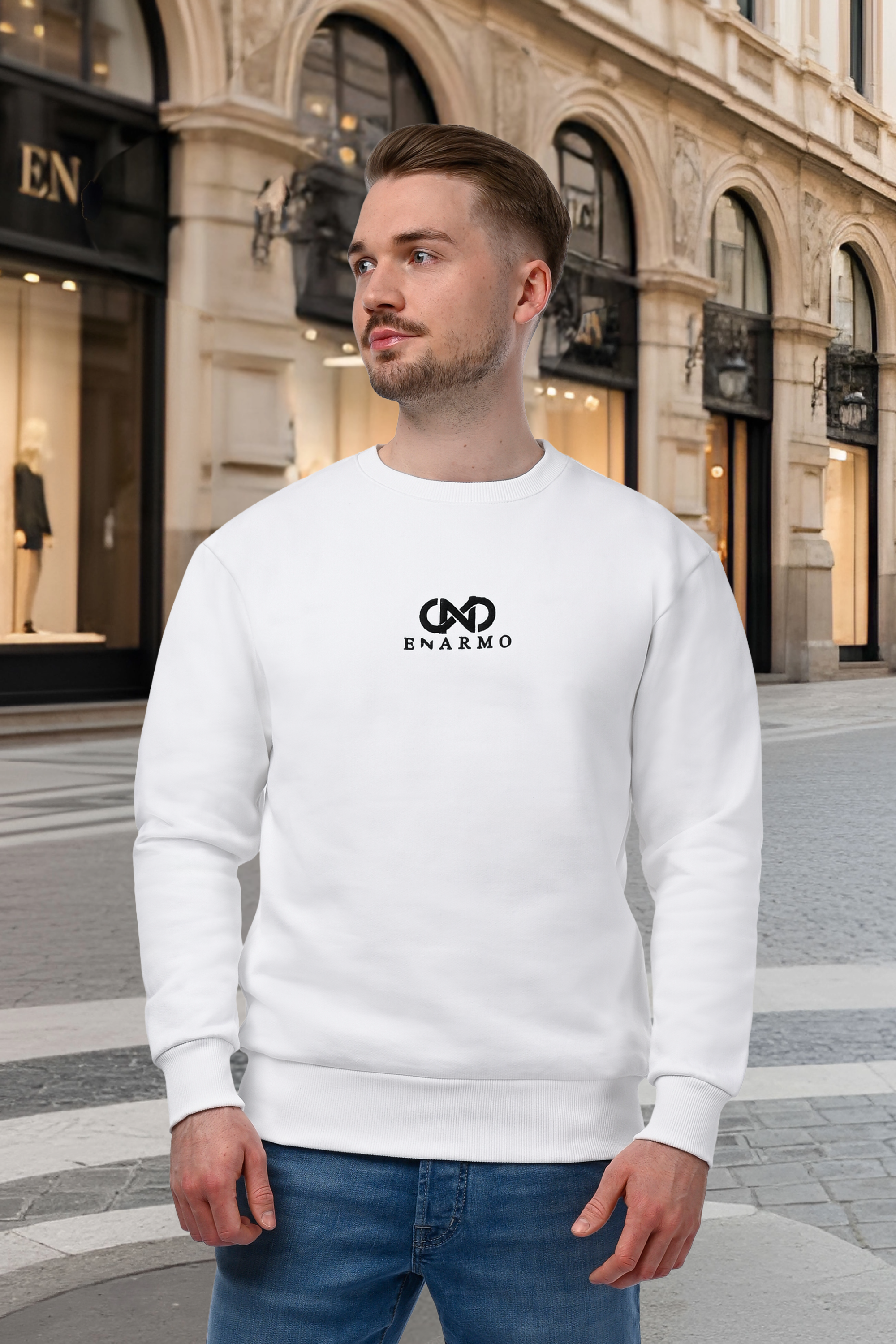 Man wearing a luxury unisex white sweatshirt with black embroidered logo, regular fit